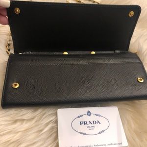 Prada Wallet On chain  with gold hardware.